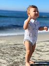 Henry, print, onesie, little, baby, standing, in, sand, dark, hair, summer, henry,