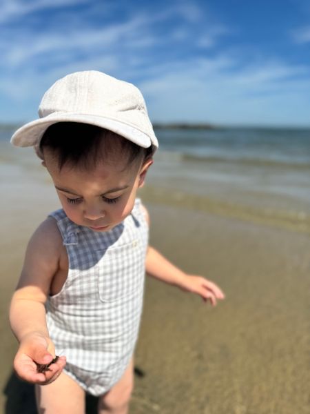 little, baby, wearing, white, woven,  cap, beige, bubble, at, beach, summer, henry.
     