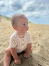 cream, ribbed, onesie, button, buttons, baby, boy, playing, in, sand,                      cool, summer, henry.