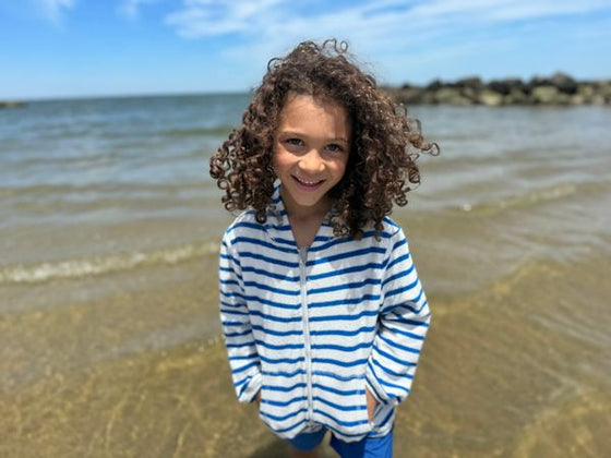 Curly Haired Boy in Royal blue stripped, stripes, stripe, terry zip up, hoody, hooded, top by henry