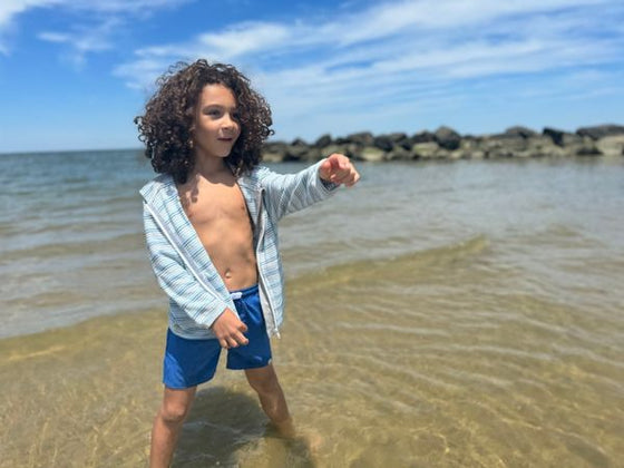 Curly Haired Boy in a Blue Ombre Terry Zip Up long sleeves sleeved sleeve Blue Shorts by Henry