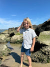 Grey, White, Woven, stripe, stripes, striped, shirt, button, buttons, navy, shorts, long, blonde, hair, boy, standing, in, the, sand, and, rocks, summer, henry.