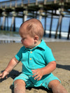 Aqua, pique, polo, romper, button, buttons, little, baby, playing, in, the, sand, at, the, pier, spring, summer,           henry.