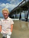 blond boy, tangerine, lime, white, stripped, stripe, stripes, short, sleeved, sleeves, polo, white, shorts.