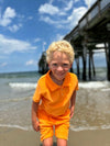 Blonde Boy in Tangerine Terry Towelling Polo, Short Sleeve, Sleeved, Sleeves, Tangerine Shorts by Henry