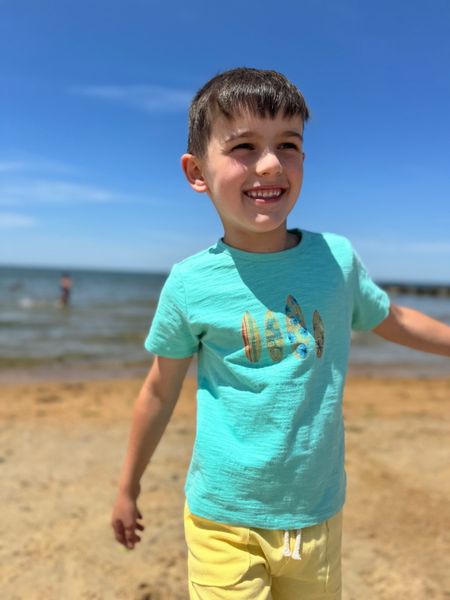 Boy, wearing, blue, surfboard, printed, tee, yellow, shorts, dark, hair, boy, walking, along, the, beach, summer, henry.