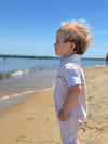 beige, white, sky, blue, arms, polo, romper, button, buttons, collar, pocket, little, boy, looking, out, sea, spring, summer, henry.