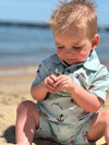 baby, boy, on, the, beach, blue, nautical, printed, romper, button, buttons, collar, brown, hair, spring, summer, henry.