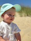 Baby, wearing, mint, woven, cap, and, white, onesie, summer, henry,