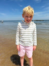 Fair Hair boy playing in the sea wearing Pink Shorts 
Grey/White Long, sleeved, sleeves, sleeve Hooded Top by Henry
