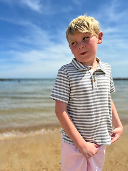 Blonde, hired, boy, grey, white, stripe, stripped, stripes, short, sleeved sleeves, polo, pink, shorts.