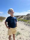 Blond Boy in a Blue Tee ,short sleeved, sleeves , Beige Terry shorts, henry, sand, dunes