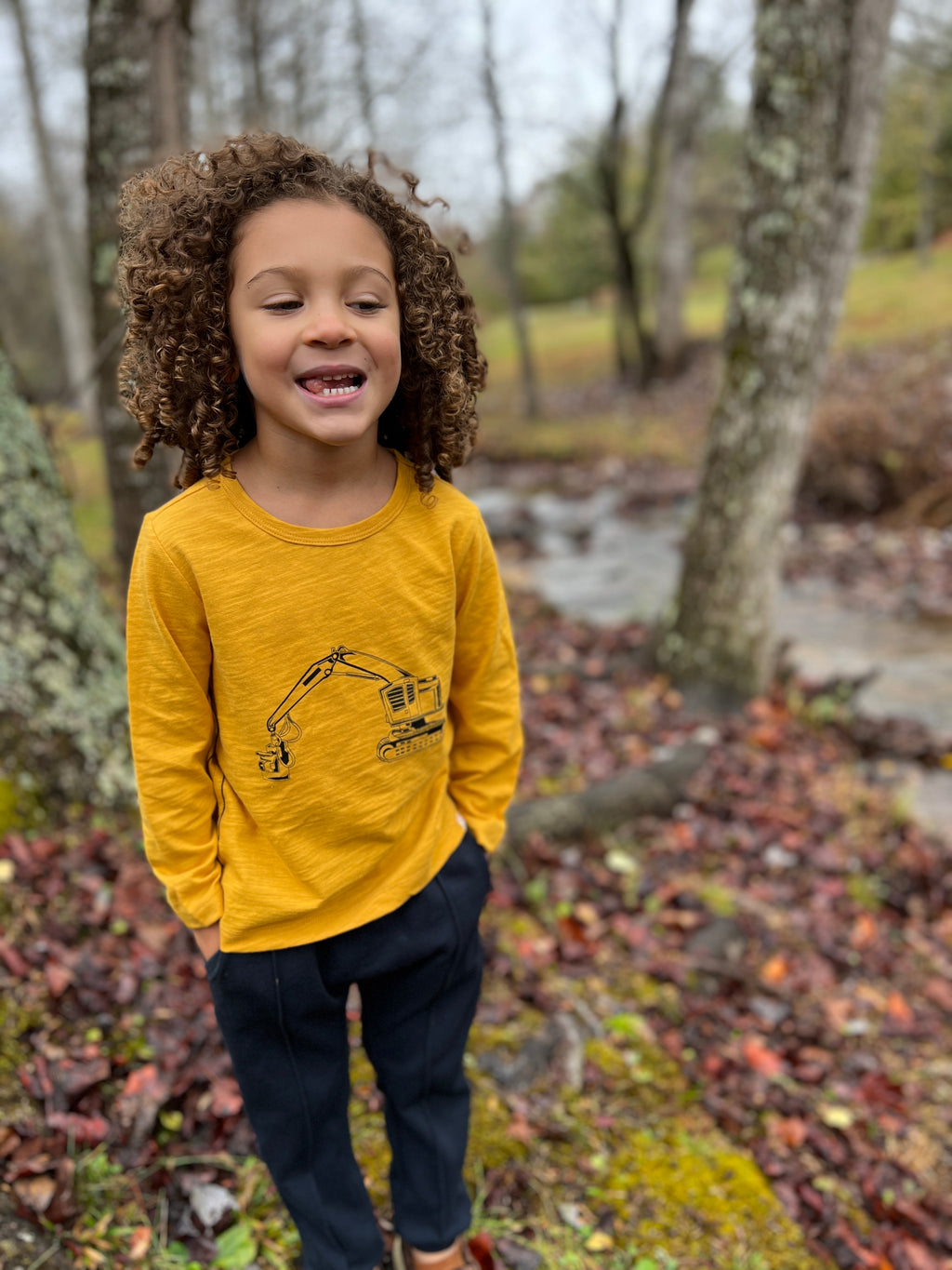 navy jog pants, white drawstrings, cuffed ankles, flexible waistband,cotton, polyester, spandex, side pockets, little boy, curly brow hair, gold digger tee, woodlands, autumn leaves