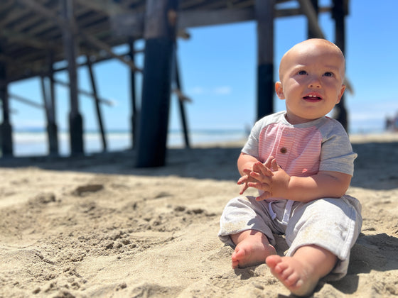 pink, white, Henley, raglan, button, buttons, onesie, beige, pants baby, boy, sitting, in, the, sand, summer, henry.