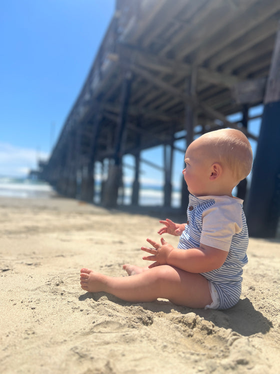 blue, white, Henley, raglan, button, buttons, pocket, onesie, little, baby, sitting, next, to, pier, in, sand, summer, henry.