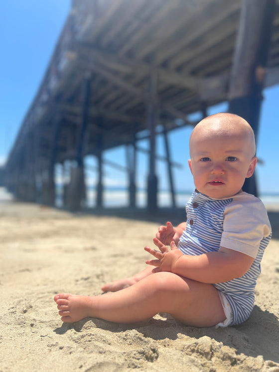 blue, white, raglan, Henley, button, buttons, pocket, onesie, baby, boy, sitting, in, sand, summer, henry. 