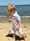 beige, white, sky, blue, arms, polo, romper, button, buttons, collar, pocket, little, boy, looking, out, sea, spring, summer, henry.