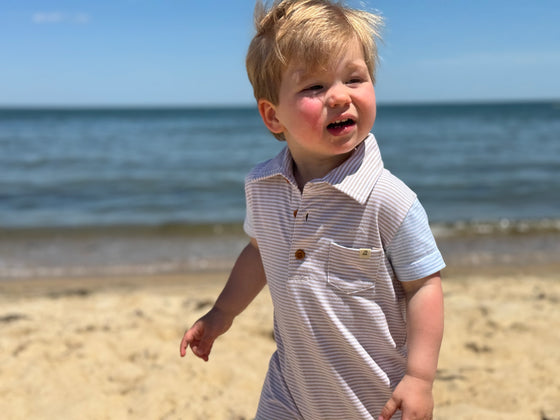 beige, white, sky, blue, arms, polo, romper, button, buttons, collar, pocket, little, boy, looking, out, sea, spring, summer, henry.