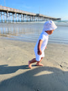white, pique  polo romper, button, buttons,  bucket, hat, little, boy, running, in, sand, spring, summer, henry.