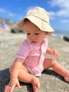 Stone, twill, bucket, hat, pink, white, onesie, sitting, at, the, beach, button, buttons, pocket, summer, henry.