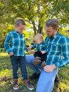 Baby, boy, dad, teal, white, plaid, woven, shirt, Atwood, Henry, blue jeans, navy pants, tan, boots, long, sleeves, sleeved, sleeve.