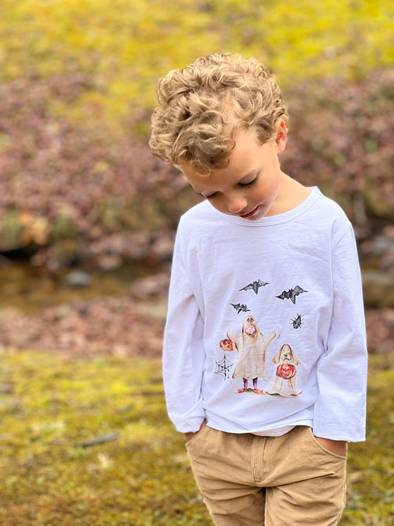  little boy, wearing white Cherokee raglan printed, print, Henry ghost, long, sleeves, sleeved, sleeve, tee, casual, tone twill pants, outside in the garden.