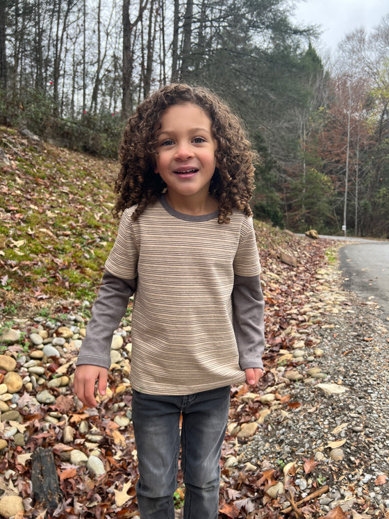 Curly, hair, boy in, Beige, Tan, Mock, sleeved, sleeves, sleeve, Tee, warm, casual, Charcoal, Jeans.