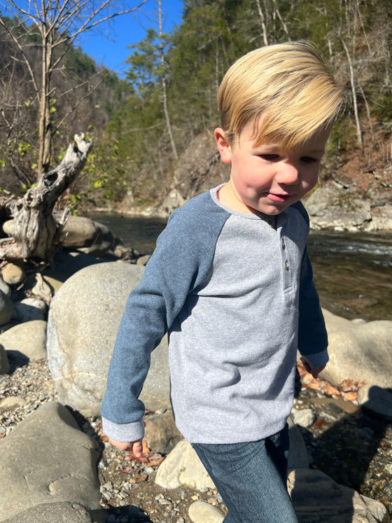 Blond, Boy on rocks next to a stream ,in ,a, Smart, Grey, Lugoff, Raglan, Tee, long, sleeves, sleeved, sleeve, warm,  Casual, Blue Jeans, Henry, buttons, button.