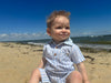 blue, white, stripe, romper, button, buttons, collar, pocket, little, baby, boy, sitting, on, the, beach, cool, spring, summer, henry.